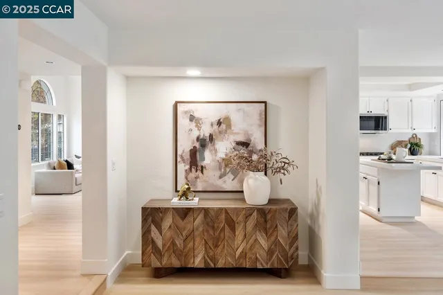 a living room with furniture and a painting