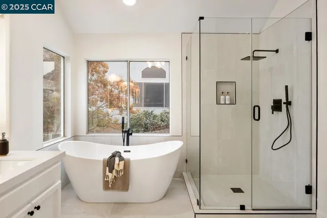 a bathroom with a bathtub and shower