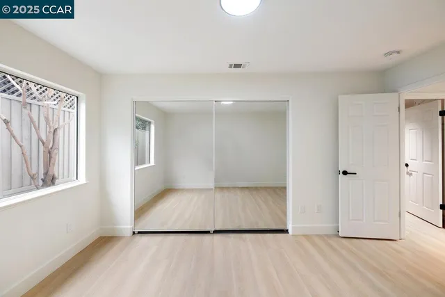a view of an empty room and window