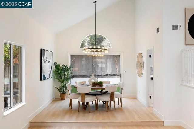 a dining room with furniture window and outdoor view