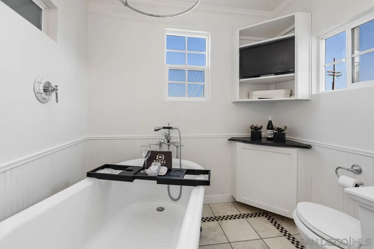 2707 Sweetwater Road Spring Valley, CA 91977 - Photo 12 of 30 a bathroom with a sink a toilet and mirror