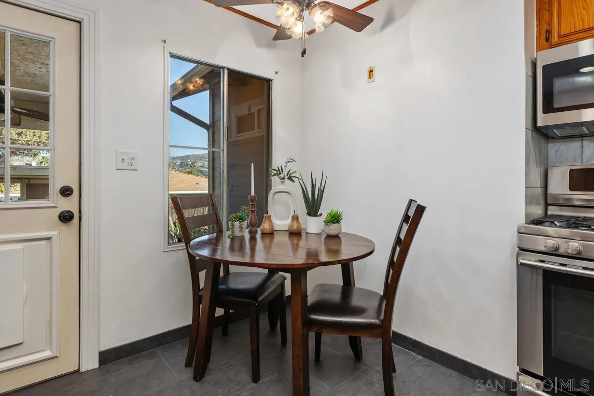2707 Sweetwater Road Spring Valley, CA 91977 - Photo 13 of 30 a view of a dining room with furniture and a potted plant