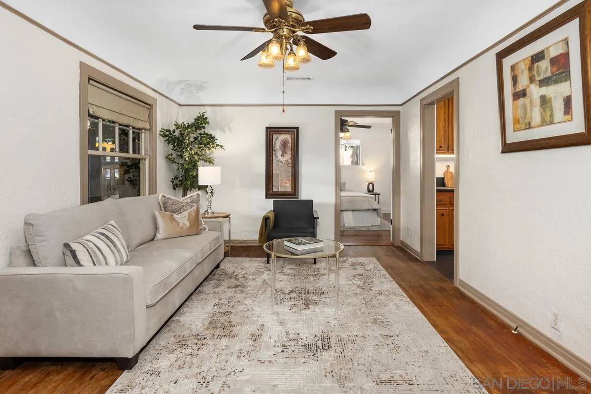2707 Sweetwater Road Spring Valley, CA 91977 - Photo 4 of 30 a living room with furniture a chandelier and a rug