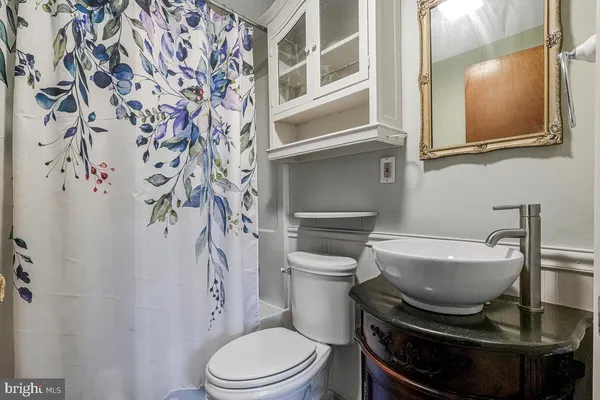 a bathroom with a toilet and a sink