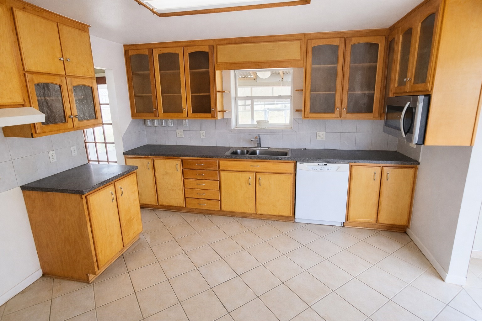 350 Robbie Lee Road Magnolia, TX 77354 - Photo 2 of 9 a kitchen with stainless steel appliances granite countertop a sink and a granite counter tops with a large window