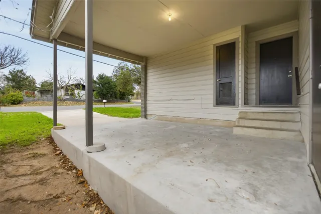 a view of a porch with a small yard