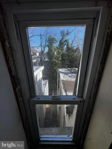 a living room with furniture window and flat screen tv