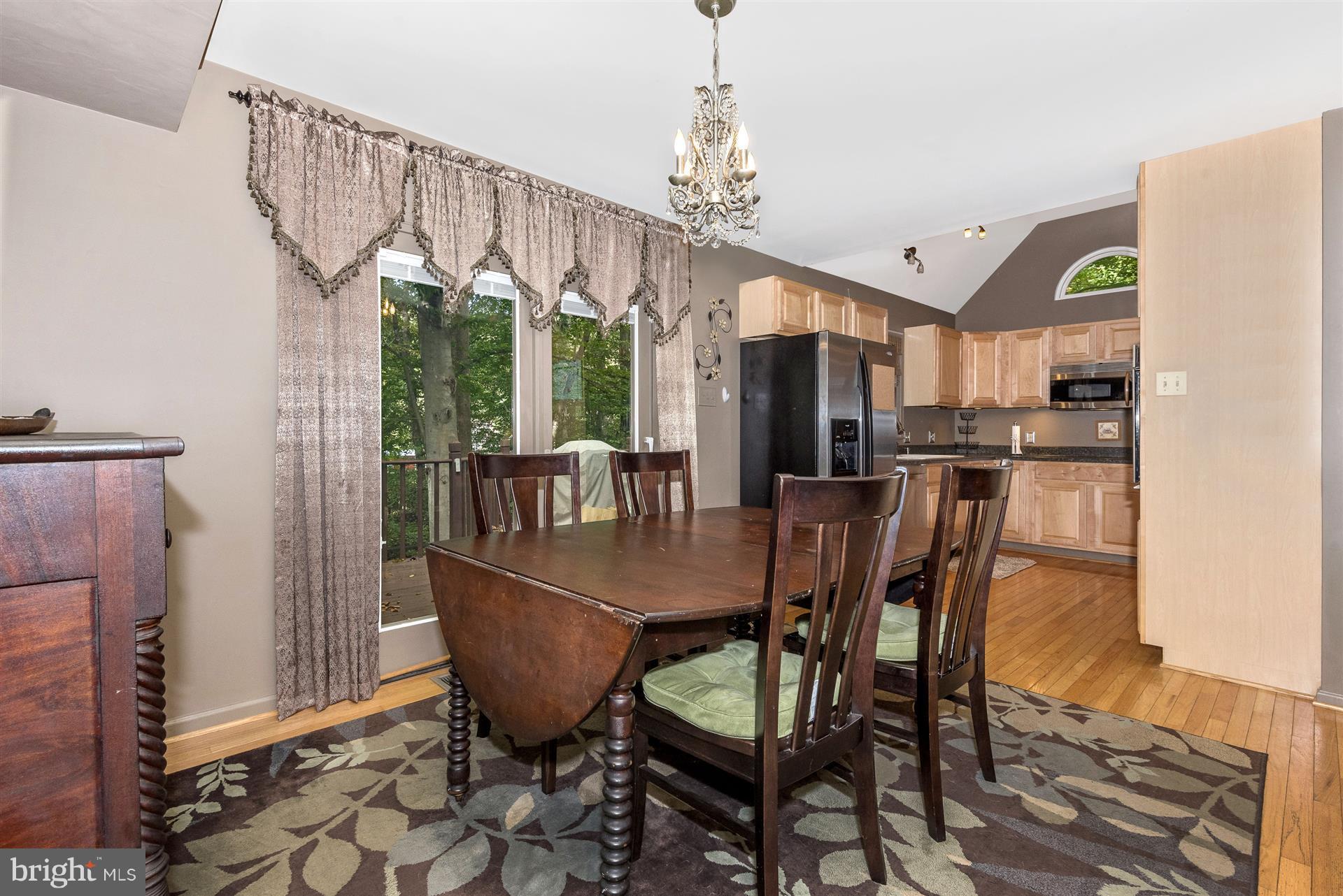 1722 Brookshire Run Point of Rocks, MD 21777 - Photo 14 of 30 a dining room with furniture a chandelier and wooden floor