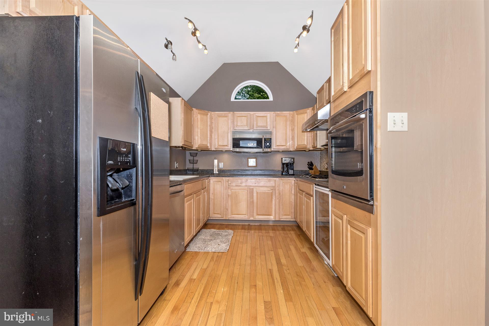 1722 Brookshire Run Point of Rocks, MD 21777 - Photo 16 of 30 a kitchen with stainless steel appliances granite countertop a refrigerator a stove and a wooden floors