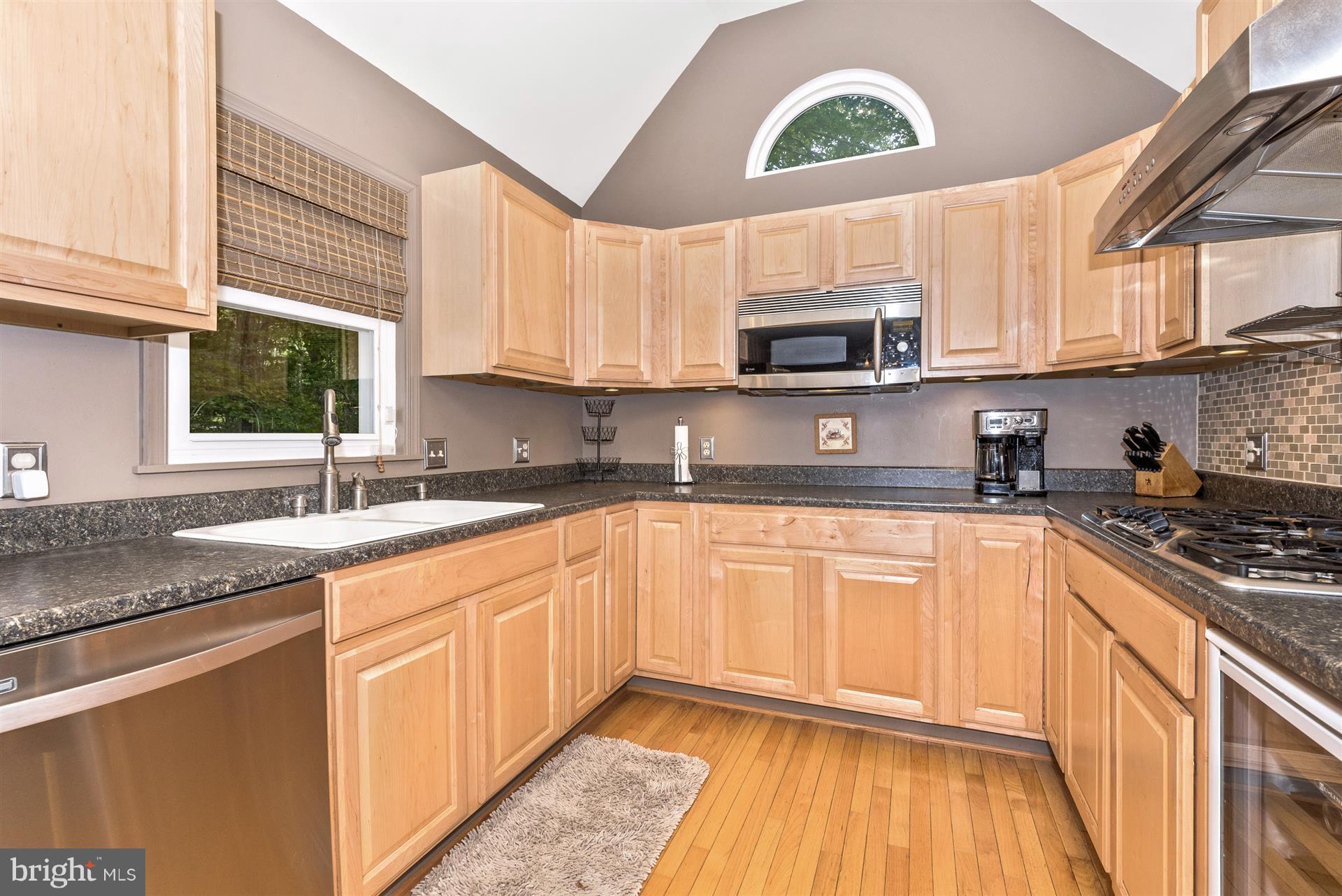1722 Brookshire Run Point of Rocks, MD 21777 - Photo 19 of 30 a kitchen with stainless steel appliances granite countertop a sink a stove a microwave and cabinets