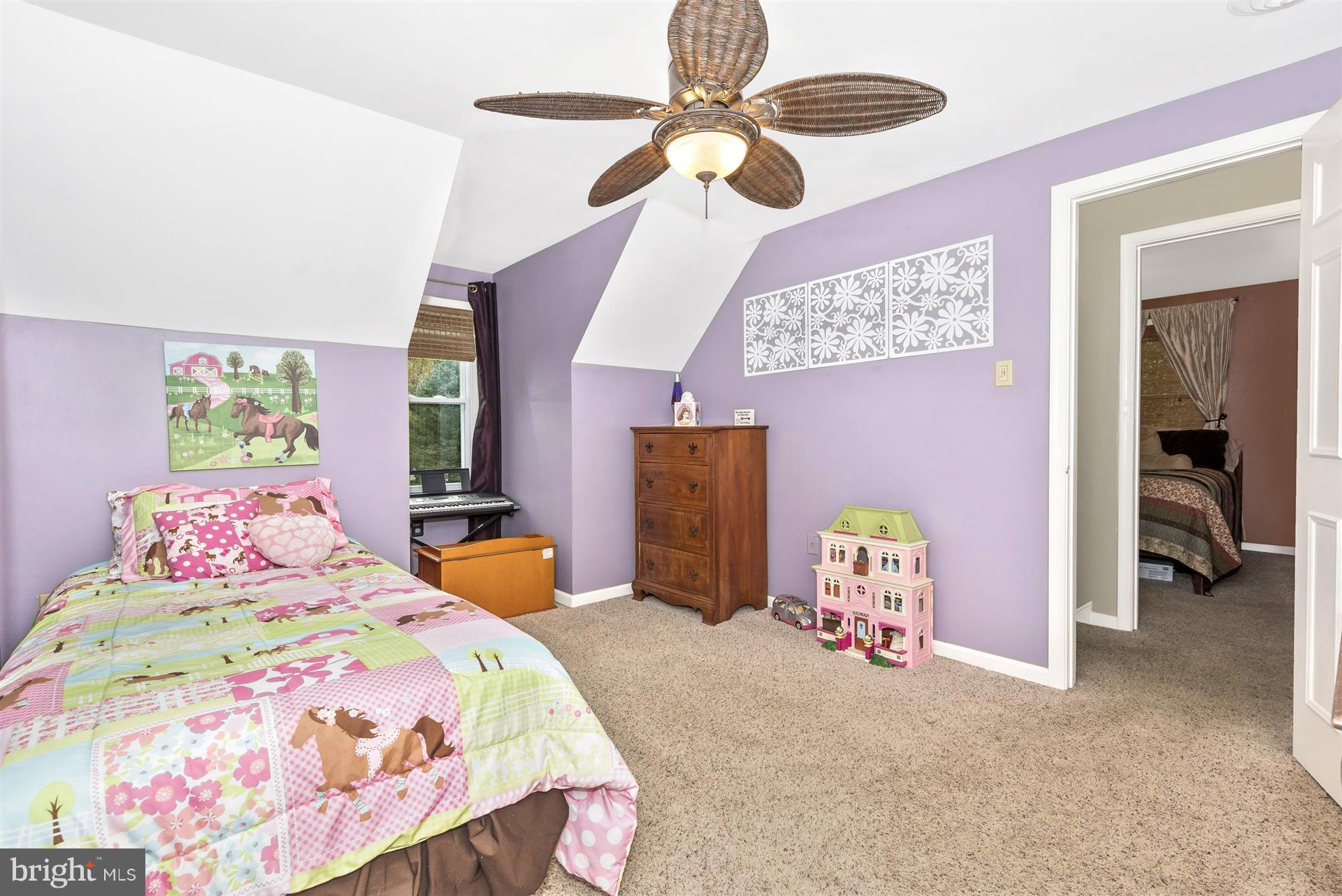 1722 Brookshire Run Point of Rocks, MD 21777 - Photo 24 of 30 a bedroom with a bed and a chandelier