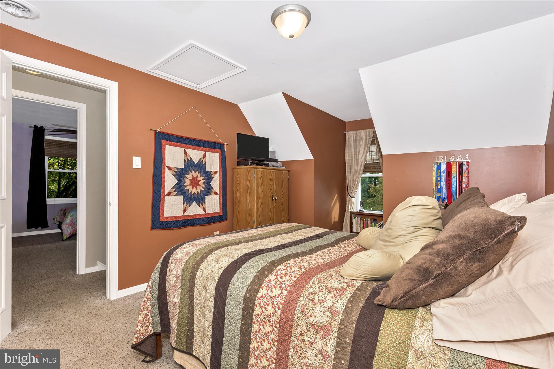 1722 Brookshire Run Point of Rocks, MD 21777 - Photo 25 of 30 a bed sitting in a bedroom next to a window