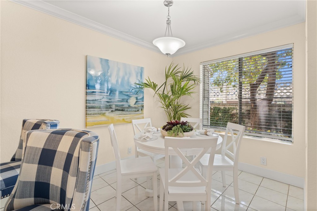 22232 South Vermont Avenue, Unit 102B Torrance, CA 90502 - Photo 11 of 26 a view of a dining room with furniture and a window