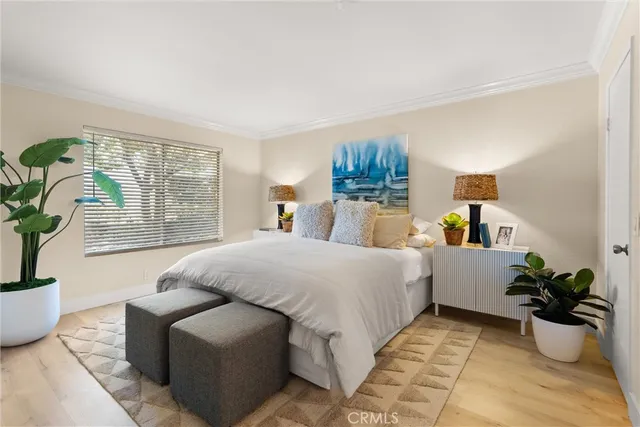 a bedroom with a bed and a lamp