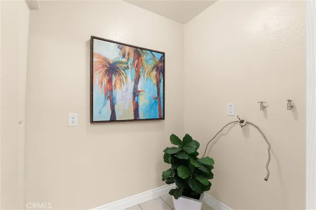 a view of a chairs and table in the balcony