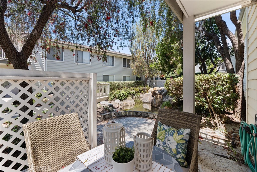 22232 South Vermont Avenue, Unit 102B Torrance, CA 90502 - Photo 22 of 26 a view of a patio with table and chairs and potted plants