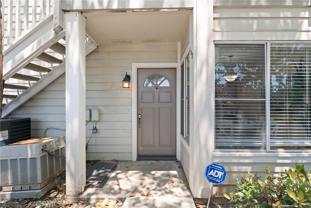 22232 South Vermont Avenue, Unit 102B Torrance, CA 90502 - Photo 23 of 26 a front view of a house with a yard