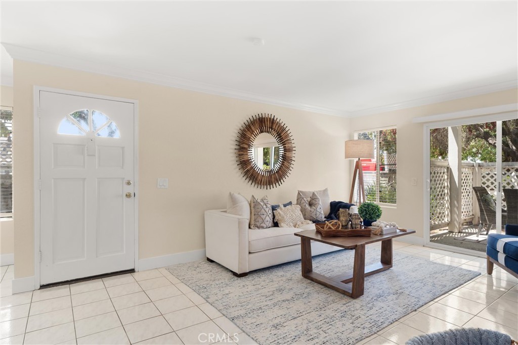 22232 South Vermont Avenue, Unit 102B Torrance, CA 90502 - Photo 4 of 26 a living room with furniture and a large window