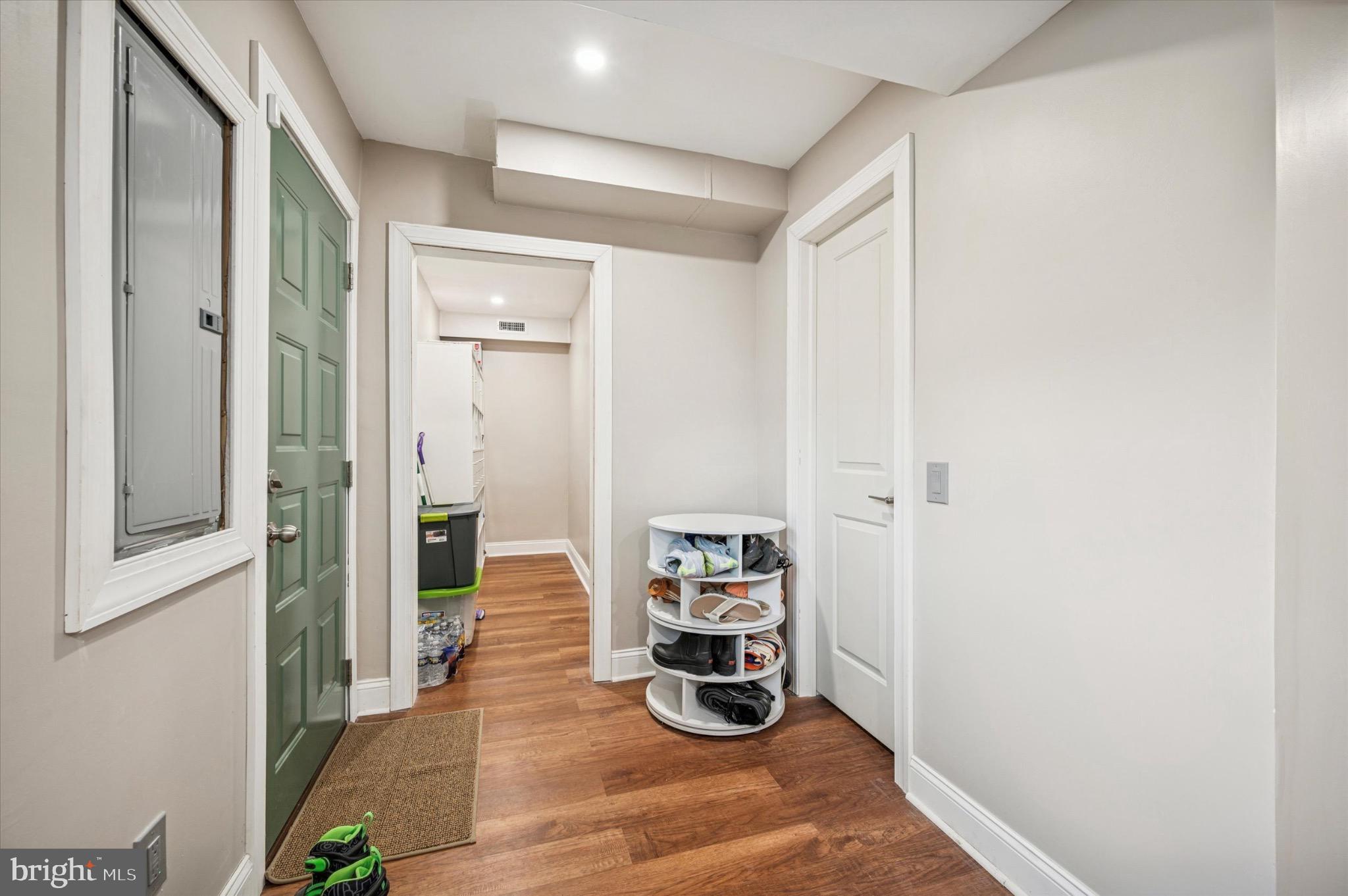 7410 Richards Road Elkins Park, PA 19027 - Photo 17 of 22 a view of a hallway with wooden floor and a livingroom with furniture