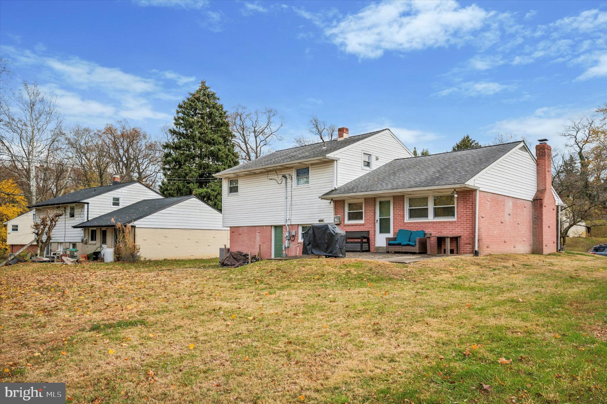 7410 Richards Road Elkins Park, PA 19027 - Photo 20 of 22 a view of a house with a big yard and large trees