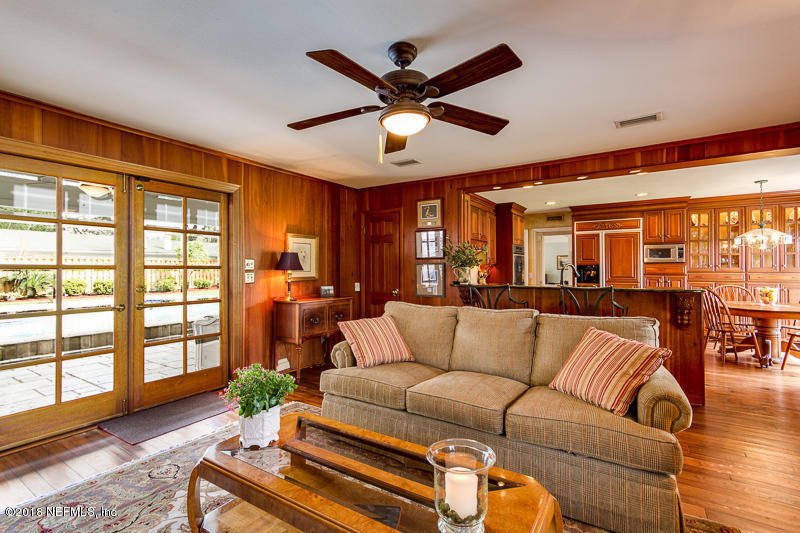 3679 Rustic Lane Jacksonville, FL 32217 - Photo 15 of 42 a living room with furniture ceiling fan and a large window