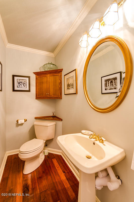 3679 Rustic Lane Jacksonville, FL 32217 - Photo 21 of 42 a bathroom with a toilet sink and mirror