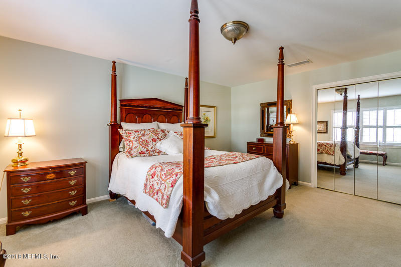 3679 Rustic Lane Jacksonville, FL 32217 - Photo 24 of 42 a bedroom with a bed and lamp