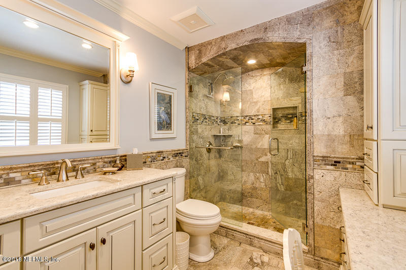 3679 Rustic Lane Jacksonville, FL 32217 - Photo 26 of 42 a bathroom with a granite countertop sink toilet a mirror and shower