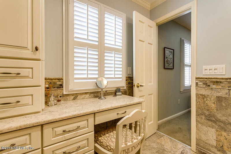 3679 Rustic Lane Jacksonville, FL 32217 - Photo 27 of 42 a bathroom with a sink and a mirror