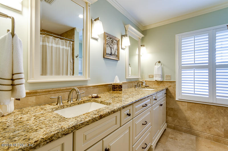 3679 Rustic Lane Jacksonville, FL 32217 - Photo 29 of 42 a bathroom with a granite countertop sink and a mirror