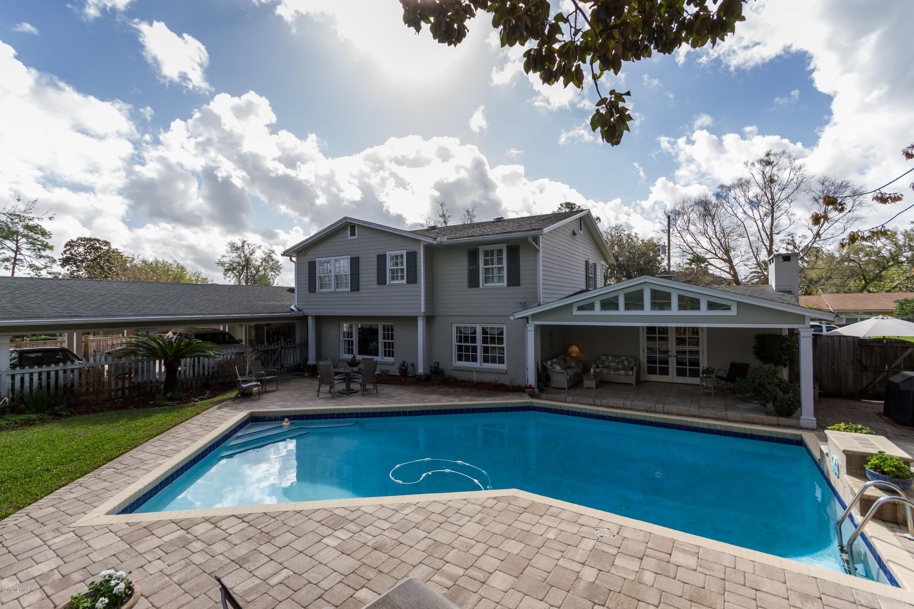 3679 Rustic Lane Jacksonville, FL 32217 - Photo 37 of 42 a front view of a house with swimming pool having outdoor seating