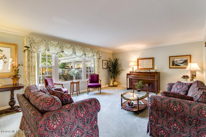 3679 Rustic Lane Jacksonville, FL 32217 - Photo 5 of 42 a living room with furniture and a flat screen tv