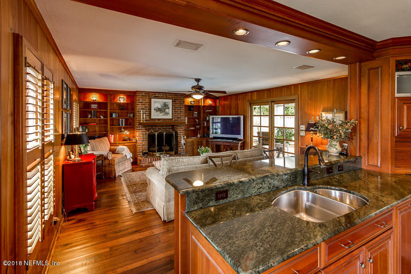 3679 Rustic Lane Jacksonville, FL 32217 - Photo 8 of 42 a kitchen with stainless steel appliances granite countertop a sink counter space and living room view