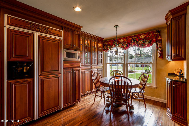 3679 Rustic Lane Jacksonville, FL 32217 - Photo 10 of 42 a view of a dining room with furniture window and wooden floor