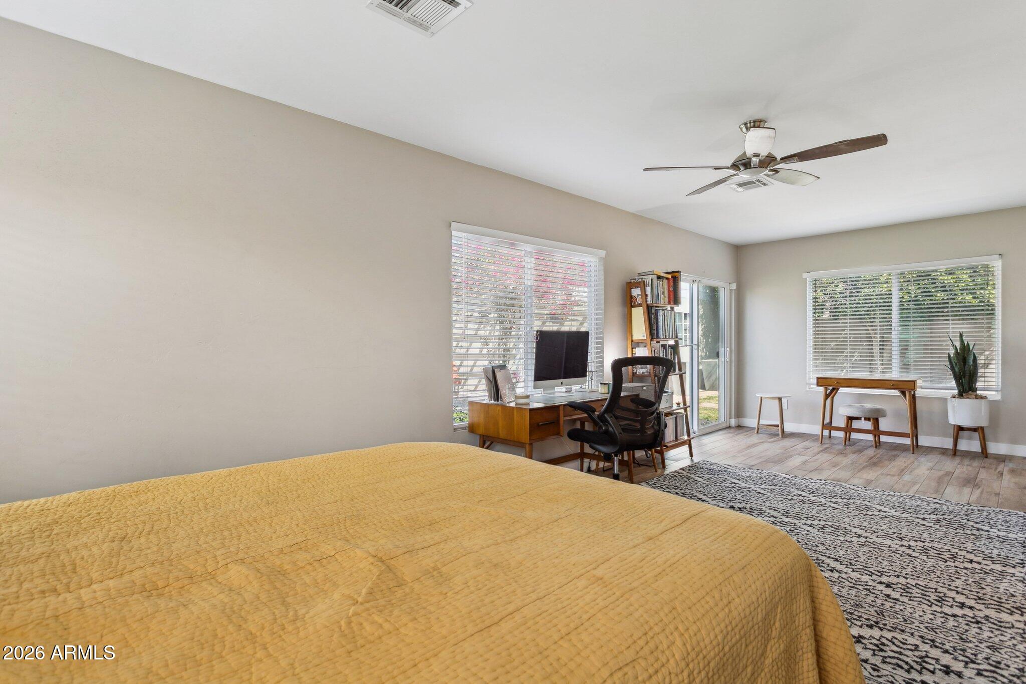 322 West Coronado Road Phoenix, AZ 85003 - Photo 56 of 93 a bed room with a bed a chair and large windows
