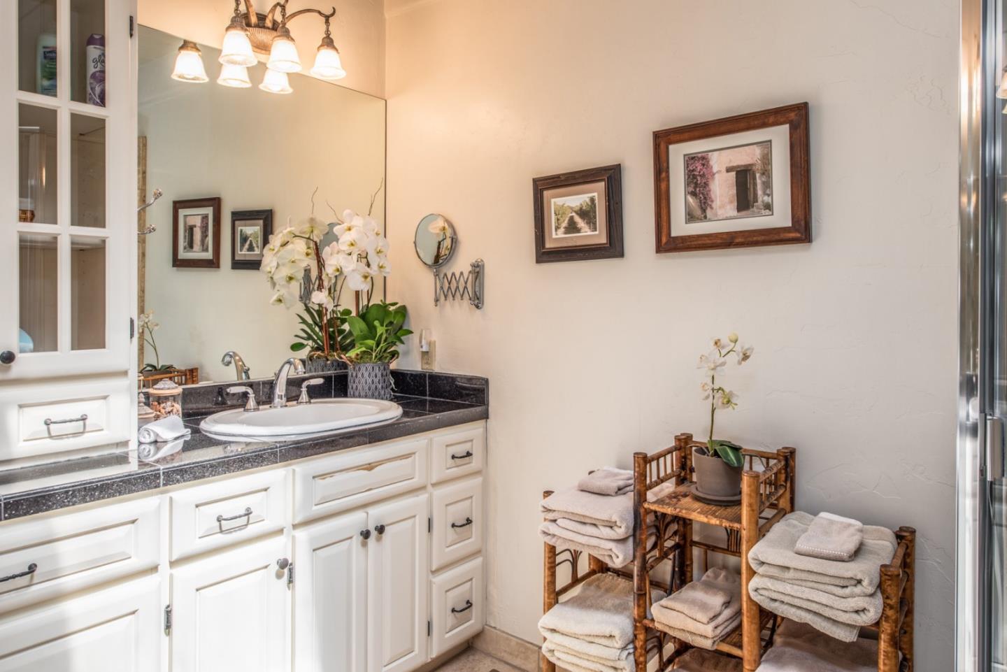 2- Carpenter & 3rd Street Carmel, CA 93921 - Photo 17 of 22 a bathroom with a sink and a mirror