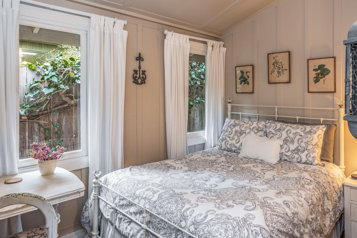 2- Carpenter & 3rd Street Carmel, CA 93921 - Photo 18 of 22 a bedroom with a large bed and a window