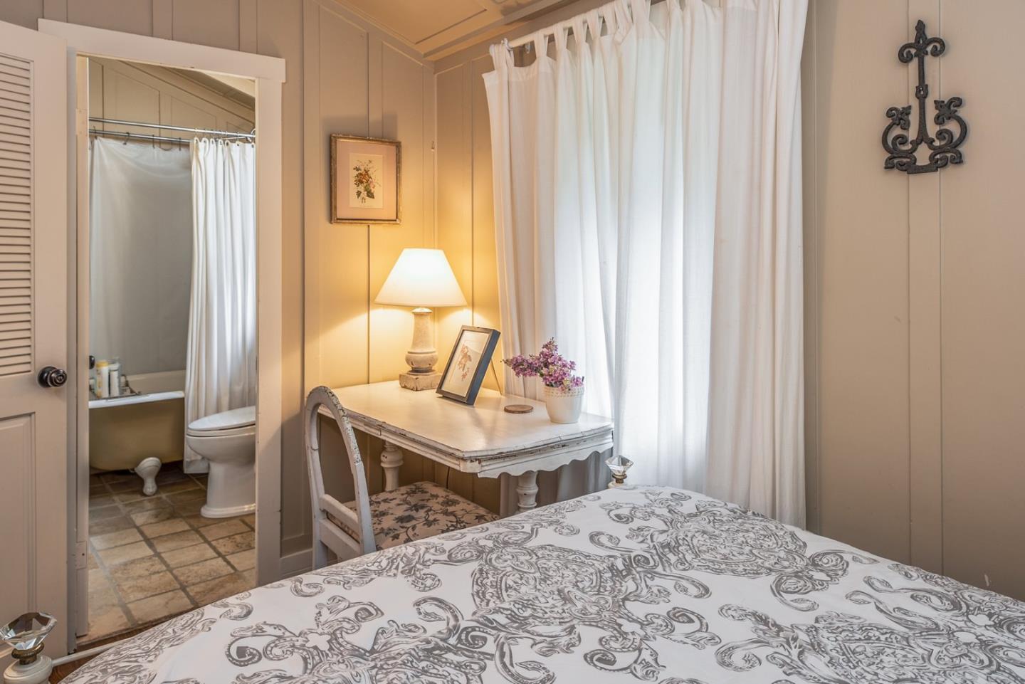 2- Carpenter & 3rd Street Carmel, CA 93921 - Photo 19 of 22 a bedroom with a bed and a window