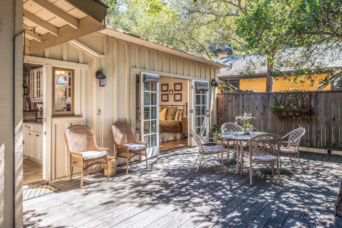 2- Carpenter & 3rd Street Carmel, CA 93921 - Photo 21 of 22 a view of a dinning table and chairs in backyard of the house