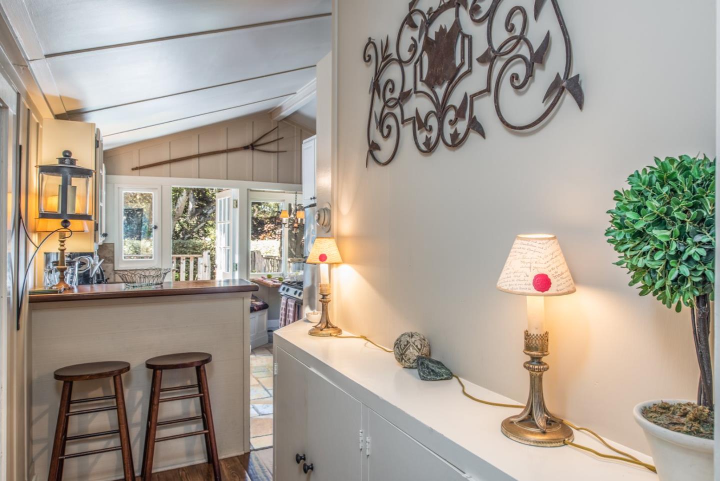 2- Carpenter & 3rd Street Carmel, CA 93921 - Photo 7 of 22 a dining room with wooden floor and a window