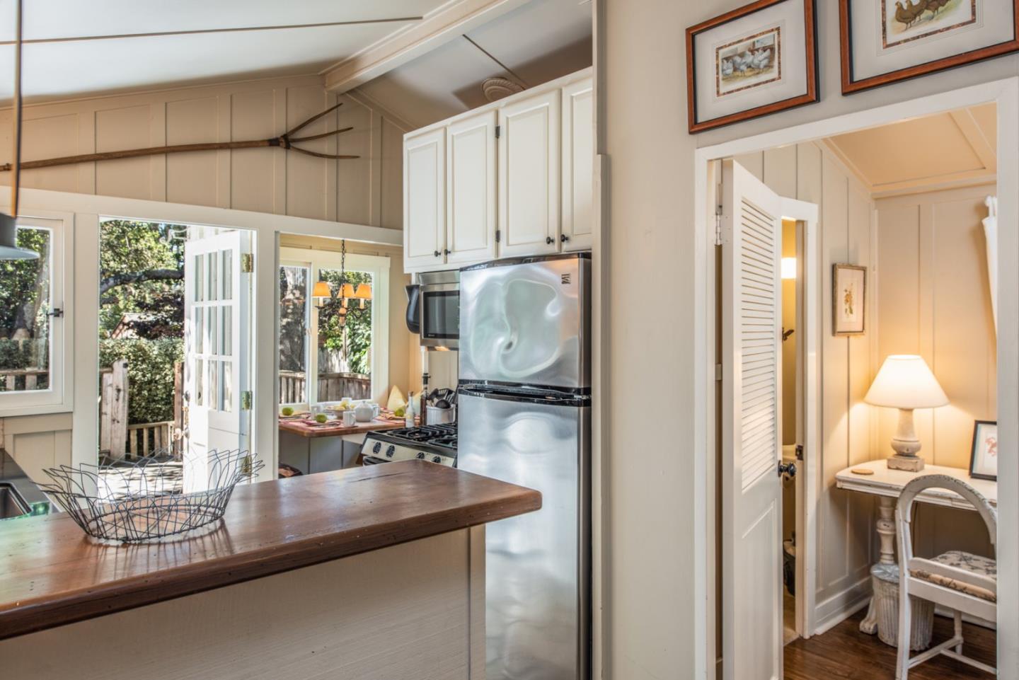 2- Carpenter & 3rd Street Carmel, CA 93921 - Photo 8 of 22 a kitchen with stainless steel appliances granite countertop a refrigerator and a sink