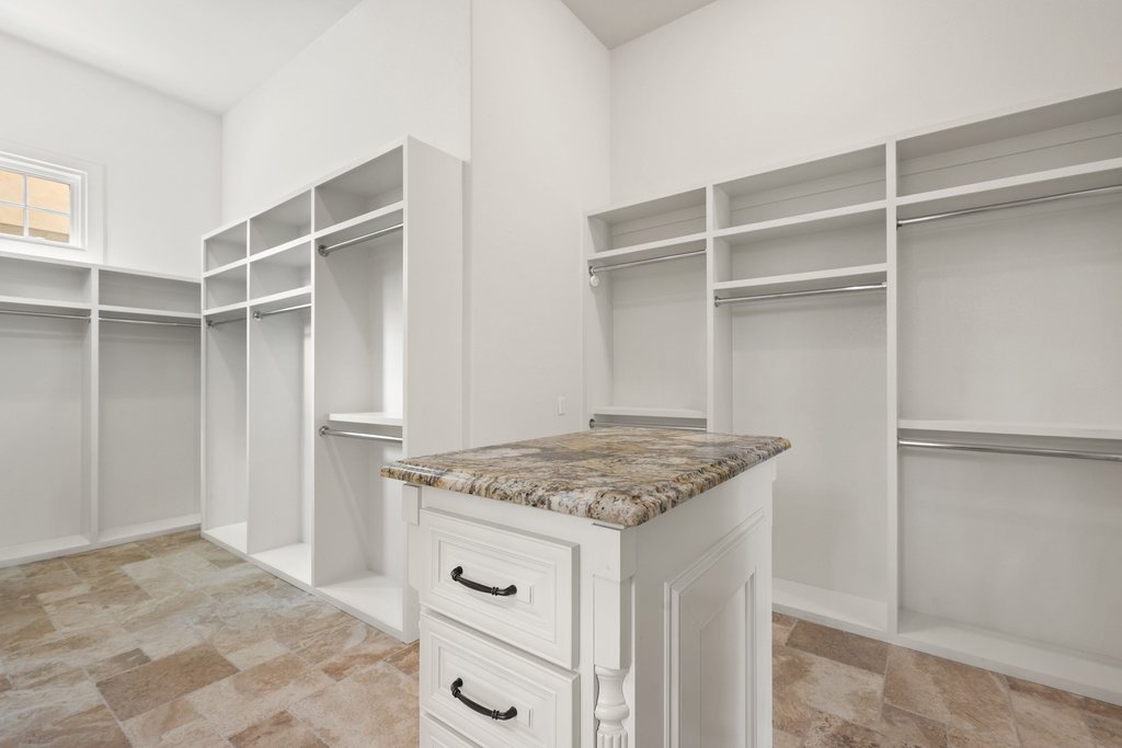 102 Long Point Cove Georgetown, TX 78628 - Photo 24 of 36 a utility room with cabinets