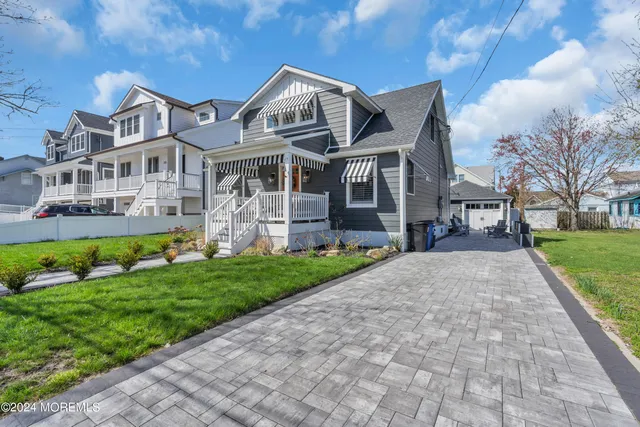 a view of house with yard entertaining space and seating area