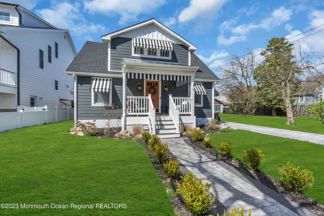 a living room with furniture and a painting on the wall