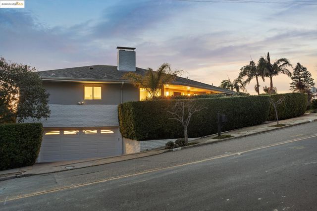 a view of a street with a building in the background