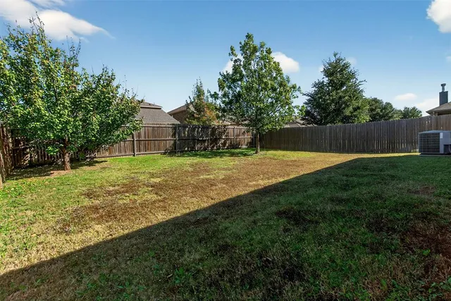 a view of a backyard with a small cabin