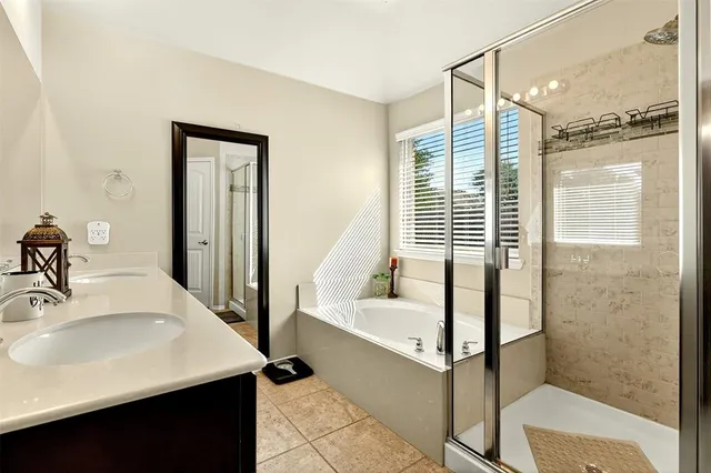 a bathroom with a bathtub and a sink