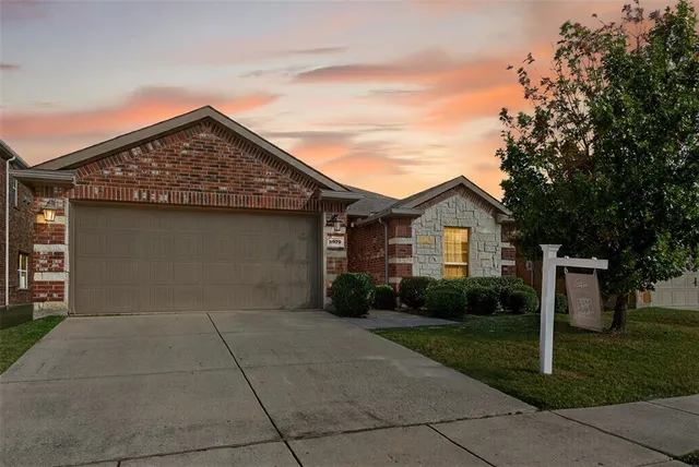 a front view of a house with yard