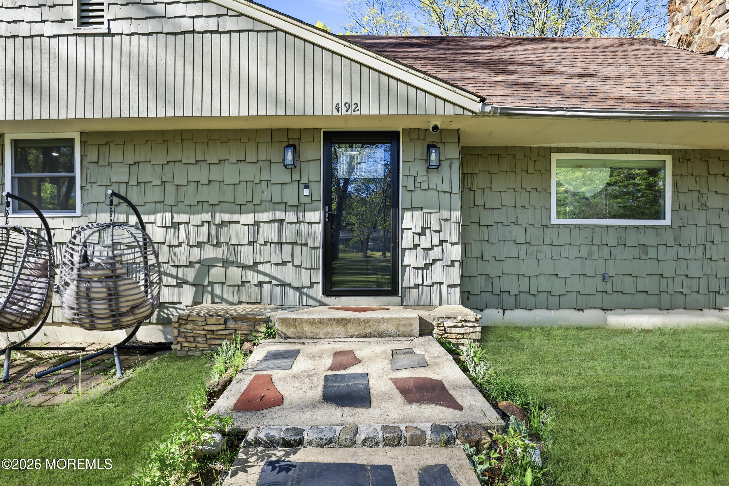492 Cobain Road Jackson, NJ 08527 - Photo 5 of 47 a front view of a house with a garden