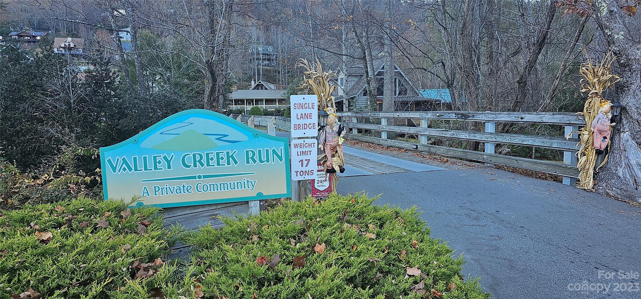 106 Silverleaf Circle Maggie Valley, NC 28751 - Photo 13 of 15 a view of outdoor space with signage and flags